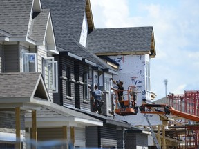 A new home is built in a housing development in Ottawa on Tuesday, July 14, 2020. Federal officials are ironing out details of a planned program to help cities buy properties left vacant due to the pandemic so they can quickly create affordable housing units, which mayors say is desperately needed.