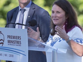 Linda Silas, president of the Canadian Federation of Nurses Unions, talks with reporters after a breakfast meeting with Canadian premiers in St. Andrews, N.B. on Friday, July 20, 2018. Health care workers in Canada made up about 20 per cent of COVID-19 infections as of late July, a figure that was higher than the global average.