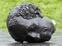The head of a statue of Sir John A. MacDonald lies on the ground following a protest in Montreal, Aug. 29, 2020.