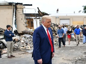 US President Donald Trump tours an area affected by civil unrest in Kenosha, Wisconsin on September 1, 2020.