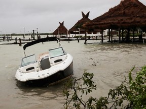A damaged boat is seen after Hurricane Delta hit, at Tortuga beach, in Cancun, in the state of Quintana Roo, Mexico October 7, 2020.