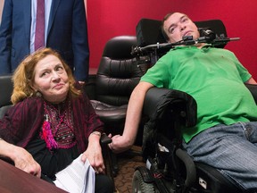 Nicole Gladu, left, and Jean Truchon at a news conference in Montreal on Sept. 12, 2019, where they gave their reaction to a Quebec judge overturning parts of provincial and federal laws on medically assisted dying.