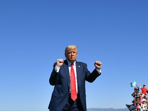 U.S. President Donald Trump gestures on stage during a rally at Prescott Regional Airport in Prescott, Arizona on October 19, 2020.