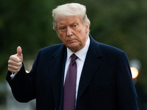 Donald Trump gives a thumbs up as he walks from Marine One after arriving on the South Lawn of the White House in Washington, DC, October 1, 2020, following campaign events in New Jersey.