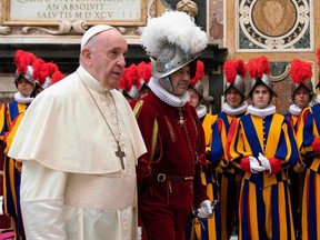 This photo taken and handout on October 2, 2020 by The Vatican Media shows Pope Francis presides over a ceremony in The Vatican's Clementine Hall, for the new Recruits of the Pontifical Swiss Guard.