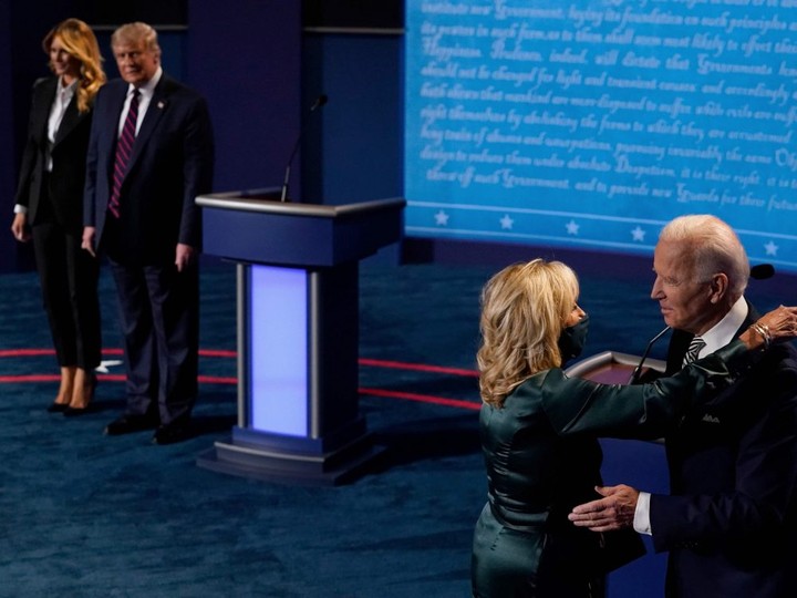  First Lady Melania Trump and President Donald Trump look on as Joe Biden hugs his wife Jill Biden after the first presidential debate in Cleveland, Ohio, September 29, 2020.