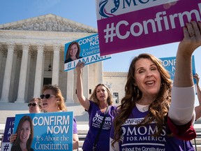 Supporters of U.S. Supreme Court nominee Judge Amy Coney Barrett demonstrate outside the Supreme Court as the Senate Judiciary Committee continues to consider Barrett's nomination on Capitol Hill on Oct. 15, 2020, in Washington, D.C.