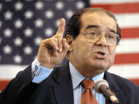 U.S. Supreme Court Justice Antonin Scalia speaks at an event in Mississippi in 2004. Scalia, who died in 2016, was a key promoter of originalism, a judicial interpretation less prominent among Canadian judges and legal scholars.