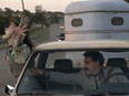 Give her a break; she's never ridden in a car before. Maria Bakalova and Sacha Baron Cohen in Borat 2.