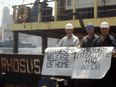 Captain Boris Prokoshev and crew members demand their release from the arrested cargo vessel Rhosus in the port of Beirut, Lebanon, in a summer 2014 photograph.
