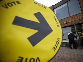 A resident enters a polling station in Toronto, Ontario, on Monday, Oct. 21, 2019.