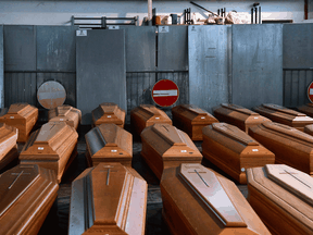 Coffins of holding victims of COVID-19 victims at a warehouse in Ponte San Pietro, Lombardy, on March 26, 2020 during the country's lockdown.