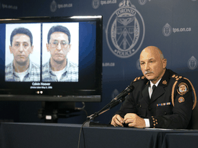 Toronto Police Chief James Ramer sits next to a screen showing photos of Christine Jessop killer Calvin Hoover during a news conference at Toronto Police headquarters, Thursday, Oct. 15, 2020.