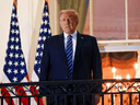 U.S. President Donald Trump poses on the Truman Balcony of the White House after his return from being hospitalized at Walter Reed Medical Center for COVID-19 treatment, October 5, 2020.