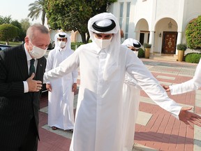 Qatar's ruler, Emir Sheikh Tamim bin Hamad Al-Thani, welcomesTurkish President Recep Tayyip Erdogan in Doha on Oct. 7, 2020.