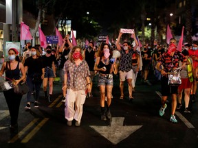 Israelis protest against Israeli Prime Minister Benjamin Netanyahu's alleged corruption and the economic hardship stemming from the coronavirus crisis, amid Israel's second nationwide lockdown, in Tel Aviv, on Oct. 8.