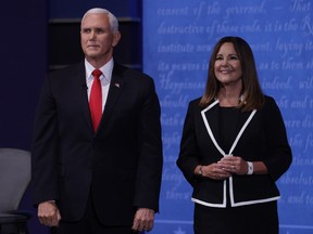 U.S. Vice President Mike Pence, left, and U.S. Second Lady Karen Pence stand on stage during the U.S. vice presidential debate at the University of Utah in Salt Lake City, Utah, U.S., on Wednesday, Oct. 7, 2020. Pence and Harris face off in their first and only debate less than a month before the election, with coronavirus adding a sudden twist to the event.