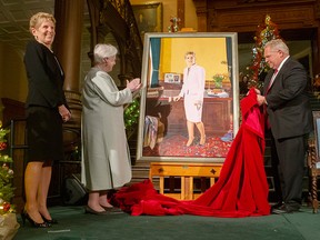 Ontario Lt.-Gov. Elizabeth Dowdeswell applauds as Premier Doug Ford unveils a portrait of former premier Kathleen Wynne in a file photo from Dec. 9, 2019. Wynne has announced she will not be seeking re-election as an MPP in the next provincial election.