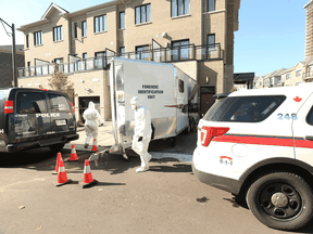 Forensic officers from York Regional Police and Toronto Police investigate the the suspected murder of a man identified as Mohammad Mehdi Amin Sadeghieh in his Markham home, Friday October 23, 2020.