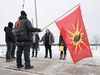 OPP Sgt. Diana Hampson, middle, speaks with members of the Mohawk Territory in Tyendinaga Mohawk Territory, near Belleville, Ont., on Tuesday, Feb. 11, 2020. The members had blocked the CN/VIA train tracks for six days in support of Wet’suwet’en’s blockade of natural gas pipeline in northern B.C.