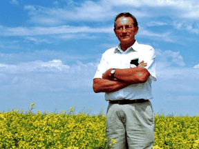 Saskatchewan farmer Percy Schmeiser stands in his field of herbicide resistant canola in 1999. Schmeiser was in a legal battle with Monsanto over his possession of the seed and crop, which Monsanto claimed was illegal to own.
