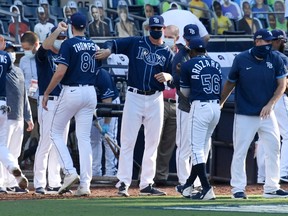 Tampa Bay Rays pitching coach Kyle Snyder celebrates with his team after their 4-2 victory against the Houston Astros in Game Two of the American League Championship Series at PETCO Park on October 12, 2020 in San Diego, California.