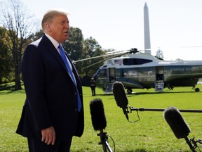 U.S. President Donald Trump speaks to members of the press prior to a Marine One departure from the White House October 15, 2020. PHOTO BY ALEX WONG/GETTY IMAGES.