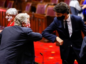 Prime Minister Justin Trudeau greets a Senator with an elbow-bump prior to the delivery of the throne speech in the Senate on Sept. 23, 2020.