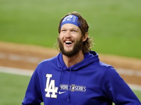 Los Angeles Dodgers starting pitcher Clayton Kershaw (22) celebrates their win over the Tampa Bay Rays in game five of the 2020 World Series at Globe Life Field.