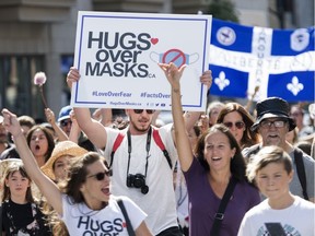 People take part in a demonstration opposing the mandatory wearing of face masks in Montreal last month.