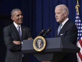 n this file photo taken on December 13, 2016, US Vice President Joe Biden (R) speaks, watched by US President Barack Obama, during the signing ceremony for the 21st Century Cures Act in the South Court Auditorium, next to the White House in Washington, DC.