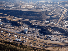 An oilsands mine near Fort McMurray in 2011. A new wave of cold water is about to hit Canada’s much-buffeted oilsands industry — with undetermined consequences.
