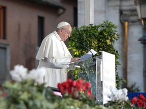 This handout picture taken on October 20, 2020 and released on October 21, 2020 by the Vatican Media, shows Pope Francis (L) delivering a speech at the Basilica of Santa Maria in Aracoeli during an inter-religious ceremony for peace in Campidoglio Square, at Rome's Capitoline Hill.
