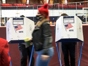 People vote at the Brooklyn Armory during early voting on October 28, 2020 in New York City.