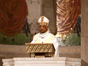 Reverend Wilton D. Gregory, Archbishop of Washington, celebrates an Easter Sunday mass in front of empty pews at the Basilica of the National Shrine of the Immaculate Conception in Washington, DC on April 12, 2020 as the Basilica remained closed to the public due to the COVID-19 coronavirus pandemic.