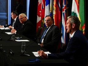 From right, Manitoba Premier Brian Pallister, Quebec Premier Francois Legault, Ontario Premier Doug Ford and Alberta Premier Jason Kenney participate in a press conference in Ottawa on Sept. 18.