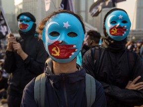 Protesters attend a rally in Hong Kong on December 22, 2019 to show support for the Uighur minority in China.