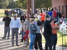 Voters wait in line to cast ballots in Effingham, S.C.