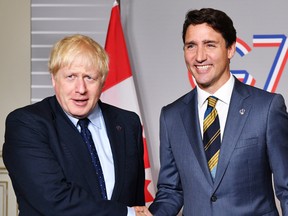 British Prime Minister Boris Johnson (L) shakes hands with Prime Minister of Canada Justin Trudeau ahead of a bilateral meeting on August 24, 2019 in Biarritz, France.