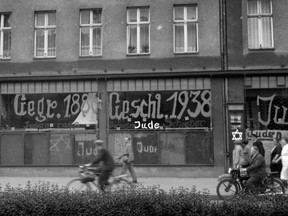 A Jewish-run store is seen on Nov. 10, 1938, after it was vandalized by Nazis and its front wall inscripted with anti-Semitic graffiti.