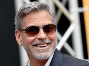 In this file photo taken on May 13, 2019  George Clooney poses during a photocall of the Catch-22 TV show in Rome.