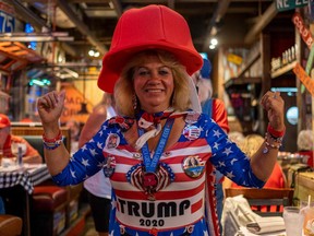 A woman poses for a photo during an election night watch party organized by a group called "Villagers for Trump" in The Villages, Florida, on November 3, 2020.
