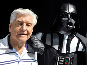 This file photo taken on April 27, 2013 during a Star Wars convention in Cusset, central France, shows David Prowse, the British actor behind the menacing black mask of Star Wars villain Darth Vader, who died aged 85 his agent said on November 29, 2020.