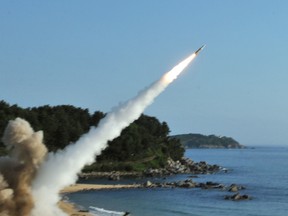 US M270 Multiple Launch Rocket System firing an MGM-140 Army Tactical Missile into the East Sea from an undisclosed location on South Korea's east coast.