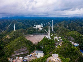 This aerial view shows the Arecibo Observatory in Arecibo, Puerto Rico, on Nov. 19, 2020. The National Science Foundation (NSF) announced on Nov.19 that it will decommission the radio telescope following two cable breaks in recent months that have brought the structure to near collapse.