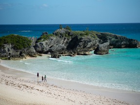 People visit Horseshoe Bay beach in Southampton, Bermuda, on Sunday, Nov. 15, 2020. With traditional tourism hammered by the pandemic and many in Europe and North America working from home amid shorter days and dropping temperatures, islands across the Caribbean are trying to attract longer-term visitors. PHOTO BY NICOLA MUIRHEAD/BLOOMBERG.