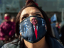 Trump supporter Teresa Rorick attends a protest against the U.S. election results outside the central counting board at the TCF Center in Detroit.