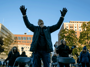 Christian believers pray during a "Pure Michigan Election Intercession" outside the state capitol building on October 31, 2020 in Lansing, Michigan.
