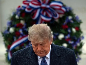 President Donald Trump places a wreath at the Tomb of the Unknown Soldier on Veterans Day at Arlington National Cemetery in Arlington, Virginia, on November 11, 2020.