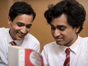 From left, Arjie and Shehan (Brandon Ingram, Rehan Mudannayake) share a love of books and more in Funny Boy.